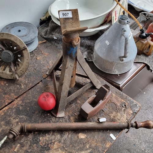 907 - Three mechanical items including a vintage woodworkers plane, a vintage axel stand and an antique mi... 