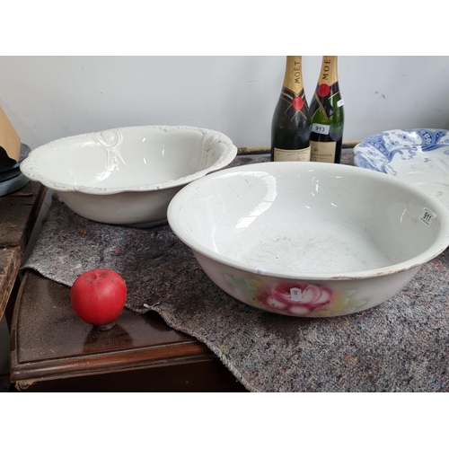 911 - Two large ceramic pedestal bowls.