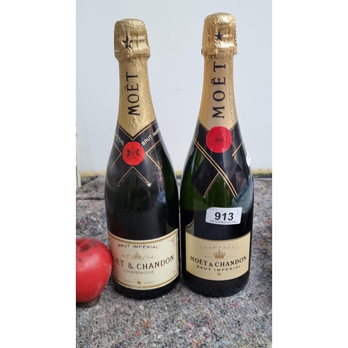 913 - Two sealed 75cl bottles of MOET & Chandon champagne.