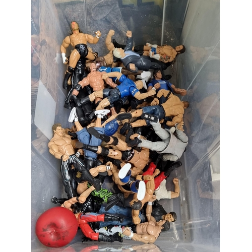 918 - A box containing a large selection of WWE wrestling figures.