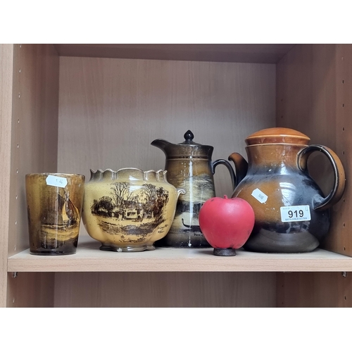 919 - A selection of pottery items including an Irish made Celtic Ennis teapot, along with a Royal Vistasw... 