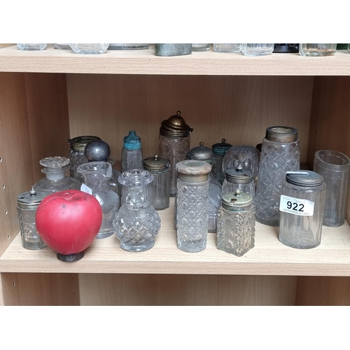 922 - An impressive large array of vintage hand cut glassware including inkwells, mustard pots, and lidded... 