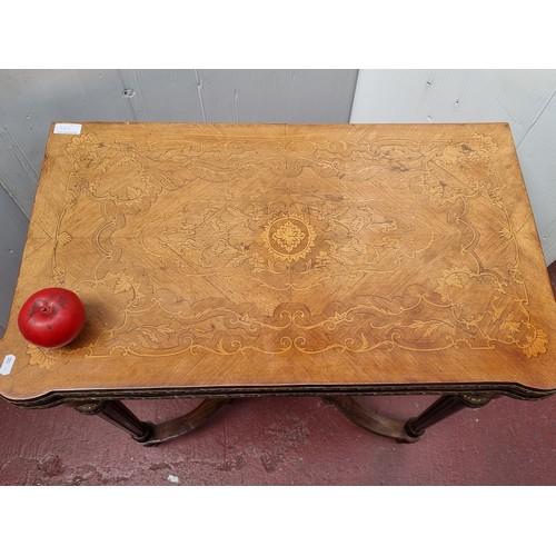 563 - Star Lot: A marvelous Louis XV-style card and games table featuring fluted tapered legs with brass t... 