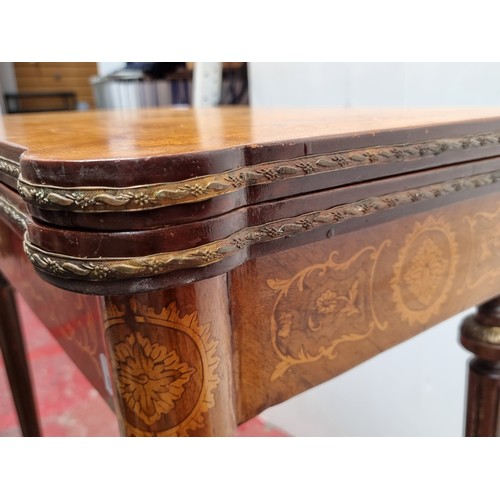 563 - Star Lot: A marvelous Louis XV-style card and games table featuring fluted tapered legs with brass t... 