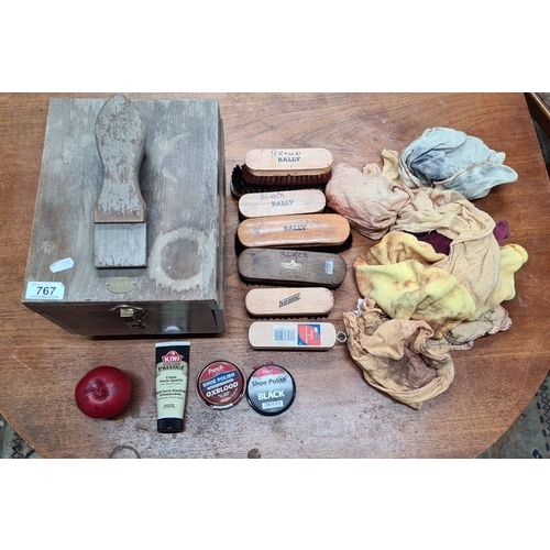 767 - A vintage Bally shoe shine kit, including wooden box, various brushes, polishes, and cloths. Branded... 