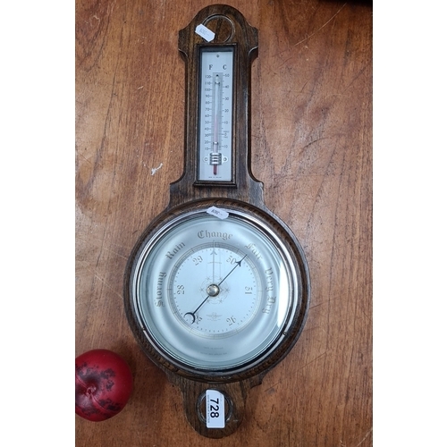 728 - A vintage oak British Shortland Smiths barometer and thermometer, featuring wood enclosure and silve... 