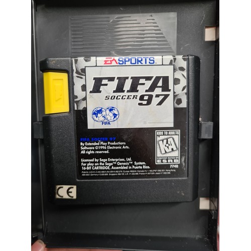 144 - Two nostalgic Sega Mega Drive console cartridge games of Sonic the hedgehog and EA Sports Fifa 97.