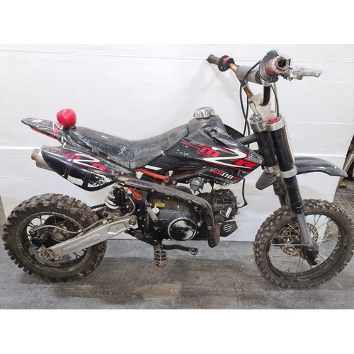 649 - Star Lot: M2R KX110 dirt bike with off-road tires and manual pedals. Petrol engine.  Unchecked.