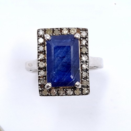 297 - A stunning large natural sapphire facet cut gemstone ring with diamond surround set in sterling silv... 