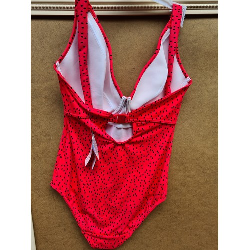 285 - A brand new with tags 'Freya' ladies swimsuit in coral pink with black polka dot effect with padded ... 