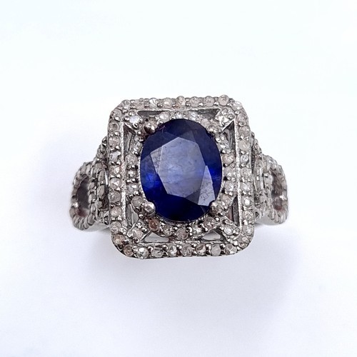 975 - Star Lot : A fine example of a natural sapphire and diamond ring mounted in sterling silver. Ring si... 