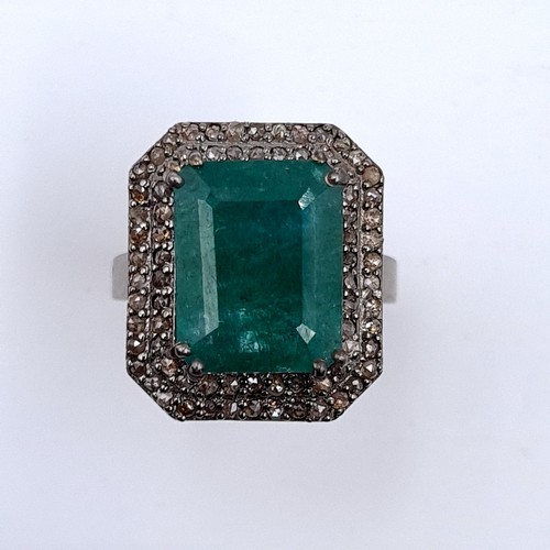 977 - Star lot : A fabulous huge natural emerald gemstone ring with diamond surround mounted in sterling s... 