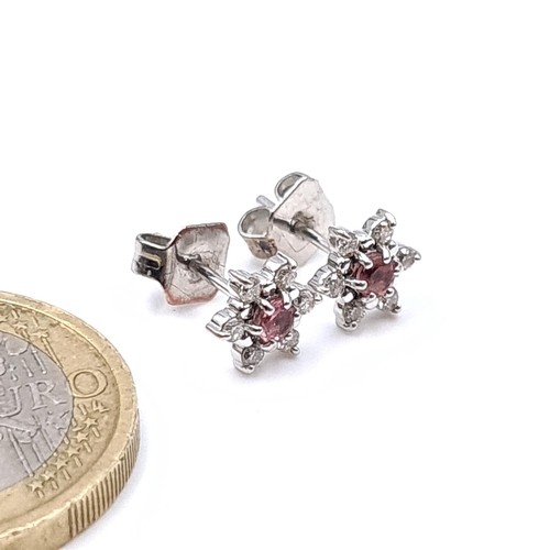 974 - Star Lot : A pair of marked 9ct white gold pink tourmaline diamond stud earrings with white diamond ... 