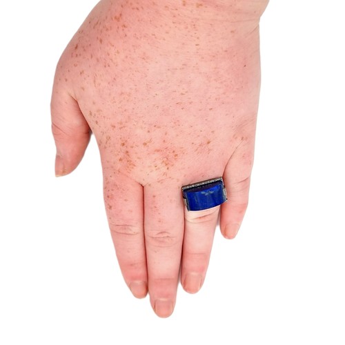 540 - A fabulous large 16 carat  Lapis Lazuli stone ring with diamond surround set in sterling silver. Sto... 