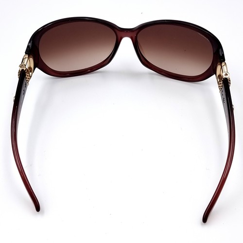 545 - A super pair of Gucci sunglasses marked 'Made in Italy' set with gold accents to frames. Together wi... 