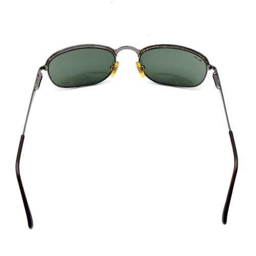 559 - A pair of original Ray-Ban as new sunglasses marked 'Made in Italy'. Comes with leather pouch.