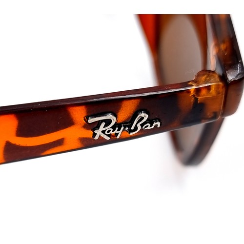 609 - A pair of Ray-Ban 'Made in Italy' mottled tortoise framed sunglasses. Comes in original case.