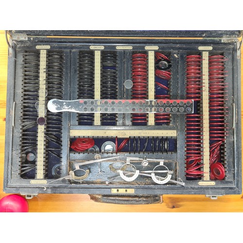 640 - Star Lot : Vintage optometrist's trial lens kit, featuring a comprehensive array of spherical and cy... 