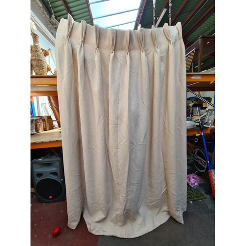 881 - One heavy weight lined curtain panel. Oatmeal colour with french pleats and measuring 50'' wide with... 