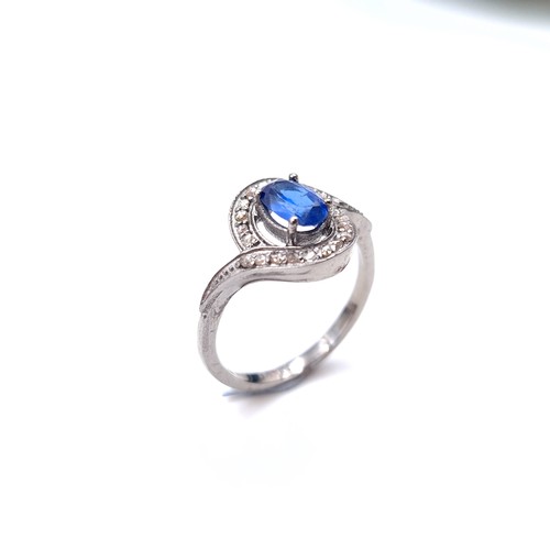 541 - Star Lot : A lovely  Kyanite blue stone ring set with diamond surround of 0.20 carats. Weight - 3 gr... 