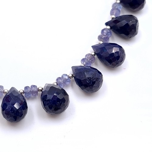 574 - An amazing graduated pear shaped tanzanite and sapphire gemstone necklace. Length - 44 cms. Weight -... 