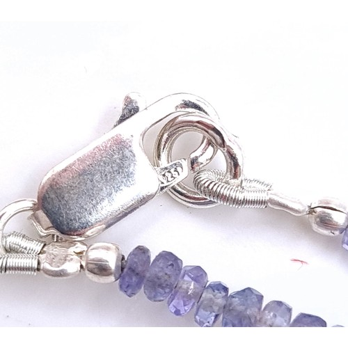 574 - An amazing graduated pear shaped tanzanite and sapphire gemstone necklace. Length - 44 cms. Weight -... 