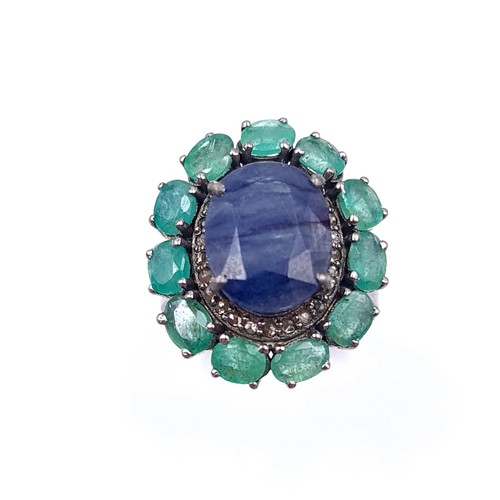 575 - A most attractive natural large sapphire stone ring with emerald stone surround mounted in sterling ... 