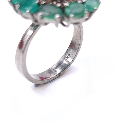 575 - A most attractive natural large sapphire stone ring with emerald stone surround mounted in sterling ... 