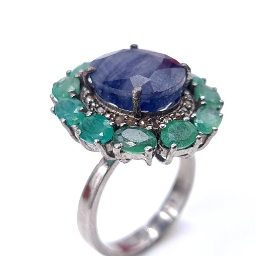 575 - A most attractive natural large sapphire stone ring with emerald stone surround mounted in sterling ... 