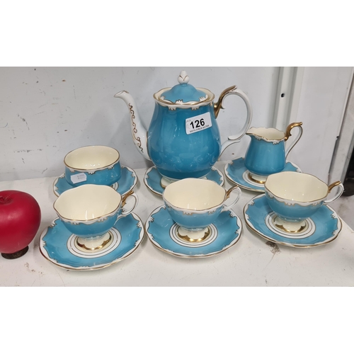 126 - A wonderful 1950's sky blue Royal Albert Tea set including three cups, three saucers, one sugar bowl... 