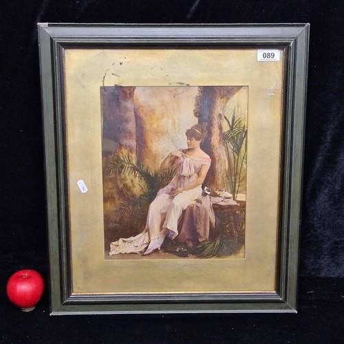 89 - A hand touched photographic print. Features an elegant lady seated by a tree. Housed in a wooden gre... 