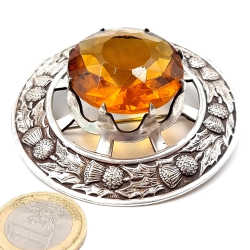 12 - A very nice example of a large Scottish amber gemstone brooch set with Scottish Thistle. Dimensions ... 