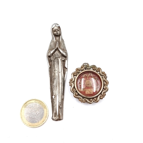 22 - Two items. The first a religious french catholic silver plated miniature statue of Holy Virgin Mary.... 