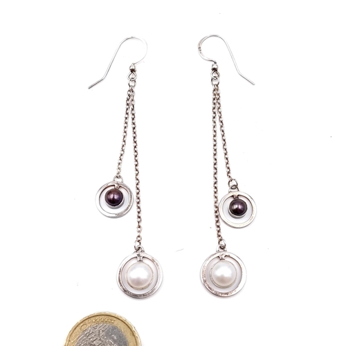 28 - A pair of sterling silver drop pendant earrings set with bi-colour pearls. Length - 8 cms. Suitable ... 