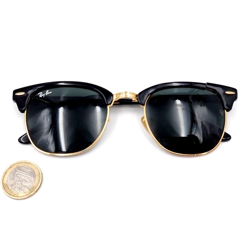 31 - A pair of rare folding sunglasses by Ray-Ban with gold metal detailing with original case.