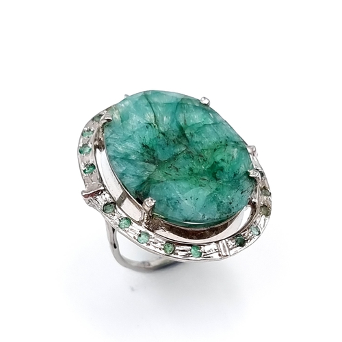 45 - Star lot : A huge natural emerald ring with emerald gemstone surround. Set in Sterling Silver Weight... 