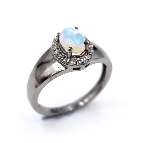 48 - Star Lot : An opal stone ring of 0.70 carats with diamond surround of 0.20 carats. set in Sterling S... 