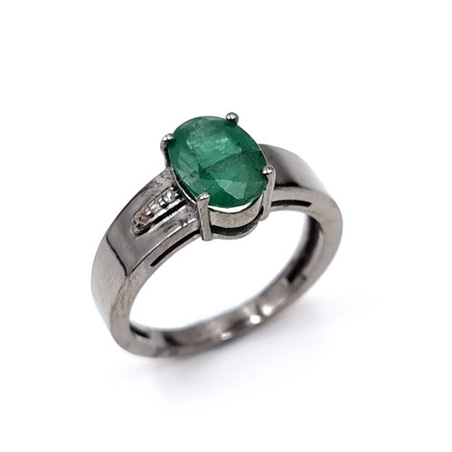 51 - Star lot : A natural emerald and diamond set ring mounted in sterling silver. Emerald - 1.8 carats. ... 