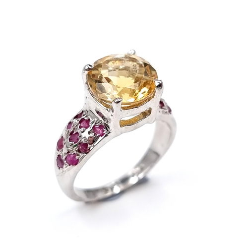 53 - A very example of a large citrine stone ring set with ruby shoulder. Set in Sterling Silver Ring siz... 