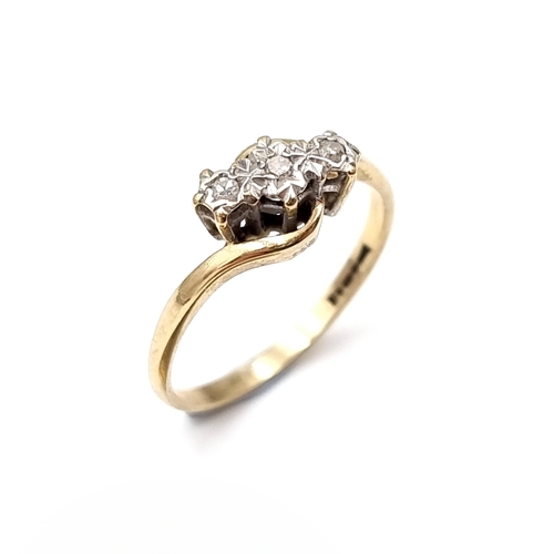 7 - A three stone illusion set diamond ring with twist mount hallmarked nine carat gold (375). Ring size... 