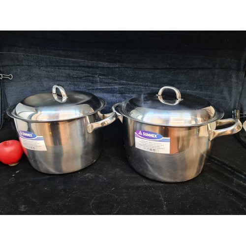 132 - Two Sunnex Stainless Steel 8L pots with matching lids. Original stickers till attached