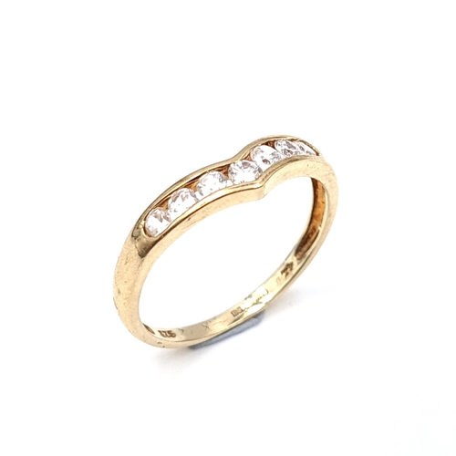 934 - A nine carat gold gem set wishbone ring. Size - N. Weight - 1.36 grams. Boxed.