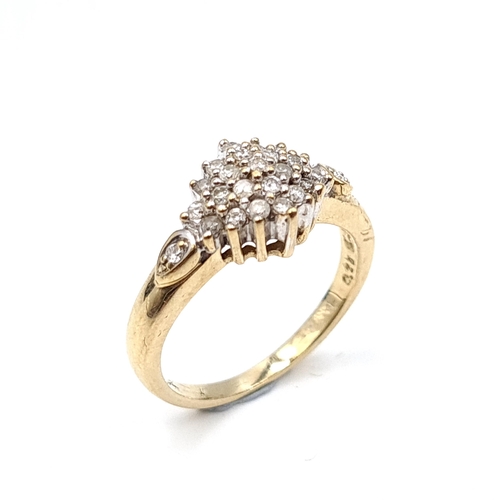 938 - A lovely vintage diamond cluster ring. Est weight of diamonds - 0.4 carats set in nine carat gold. R... 