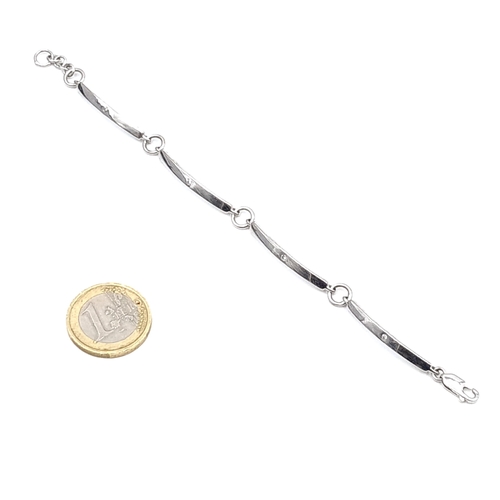 940 - A sterling silver twist link bracelet with 4 natural Diamonds one in each section . Weight - 8.28 gr... 