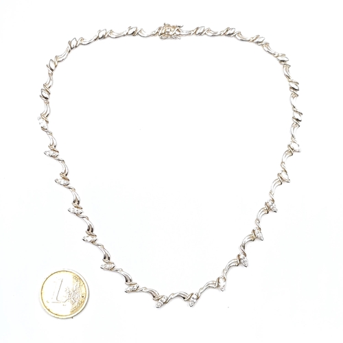 942 - A sterling silver gem set necklace. length - 42 cms. Weight - 15.74 grams. Boxed.