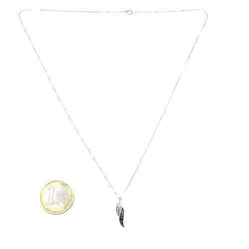 948 - A fine 9ct whit gold chain with a 9ct white gold pendent with black and white diamonds.  - 46 cms. B... 