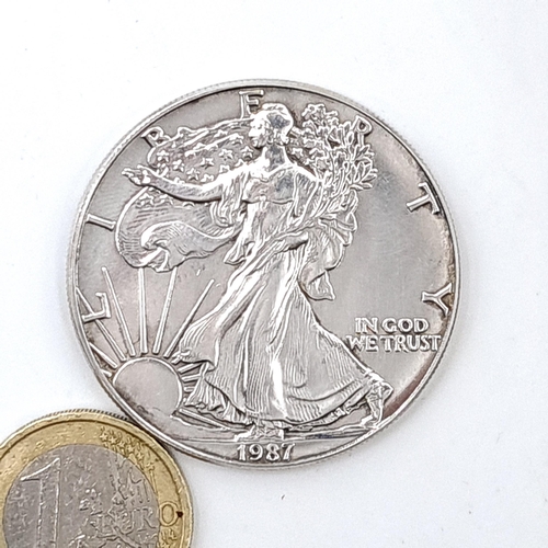 950 - A United States of America 1987 Liberty walking American silver eagle in one ounce fine silver and u... 