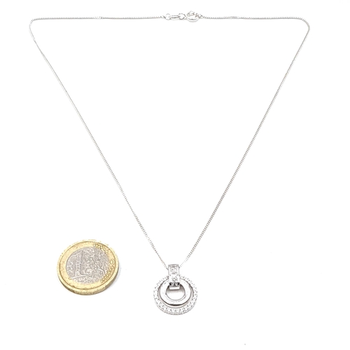 963 - A sterling silver gem set pendant necklace. Length of chain - 40 cms. Weight - 5.24 grams.