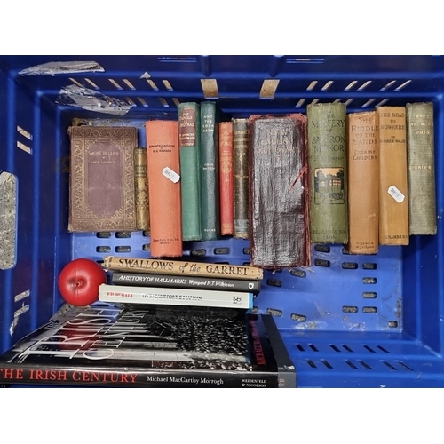 Mixed lot of 14 vintage books including titles by Jack London, L.T. Meade, Erskine Childers, and Maurice Walsh. Notable editions include a 1932 print.