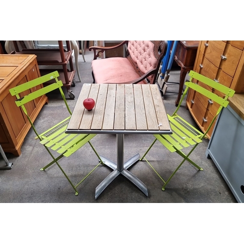 868 - Star lot : Contemporary Nisbets Bolero garden set consisting of two folding chairs in vibrant green ... 